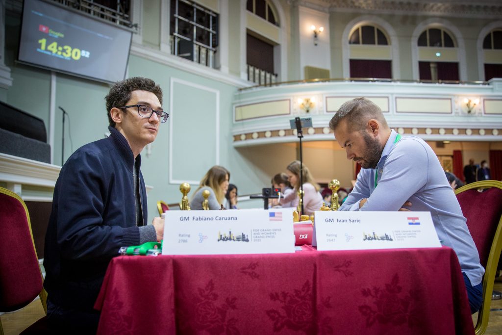 Grand Swiss 10: Caruana and Wang Hao lead